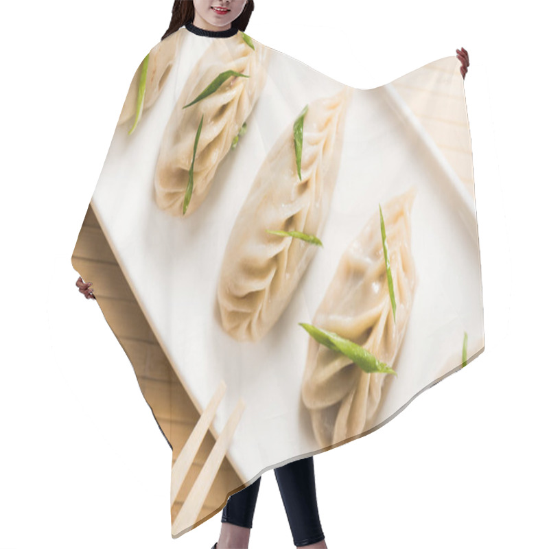 Personality  Top View Of Delicious Chinese Boiled Dumplings On Plate Near Chopsticks On Bamboo Mat Hair Cutting Cape