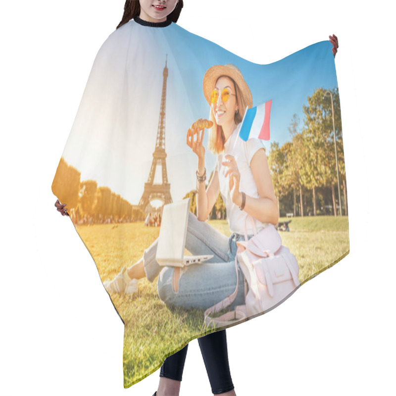 Personality  Happy Asian Girl With French Flag Eating Croissant And Learning Foreign Languages On Laptop With Eiffel Tower In The Background. The Concept Of Modern Distance Learning For Students In Paris Hair Cutting Cape