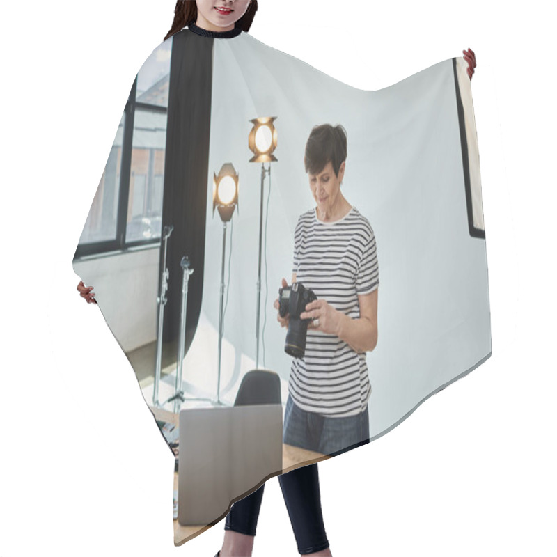 Personality  A Woman Skillfully Holds A Camera In Front Of A Laptop Screen, Capturing Digital Content For Creative Purposes. Hair Cutting Cape