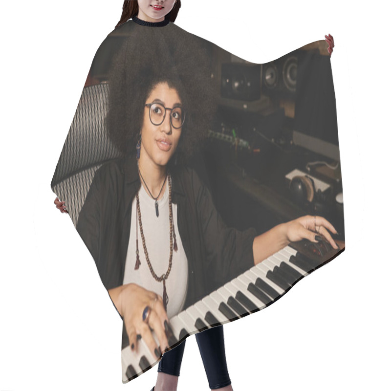 Personality  A Talented Woman In Glasses Plays A Keyboard With Passion And Focus In A Recording Studio During A Music Band Rehearsal. Hair Cutting Cape