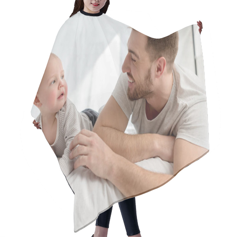 Personality  Smiling Father With Little Baby Boy Lying On Bed Hair Cutting Cape