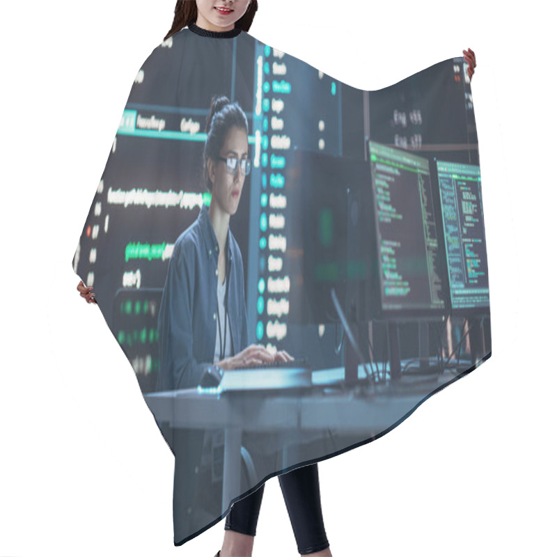 Personality  Female Programmer Working In Monitoring Control Room, Surrounded By Big Screens Displaying Lines Of Programming Language Code. Portrait Of Woman Hair Cutting Cape