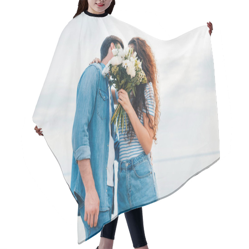 Personality  Couple Embracing And Kissing Behind The Bouquet Near Sea  Hair Cutting Cape