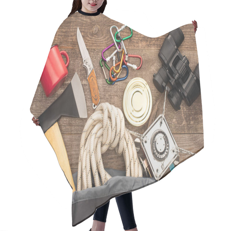 Personality  Top View Of Hiking Equipment In Backpack On Wooden Surface Hair Cutting Cape