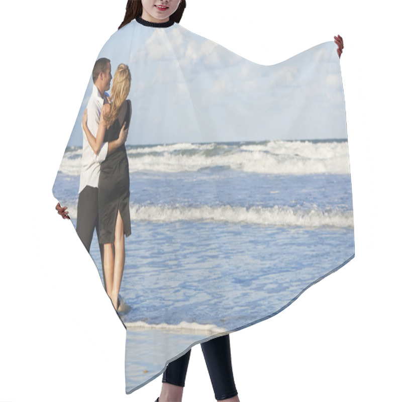 Personality  Man And Woman Couple Having Fun Embracing On A Beach Hair Cutting Cape