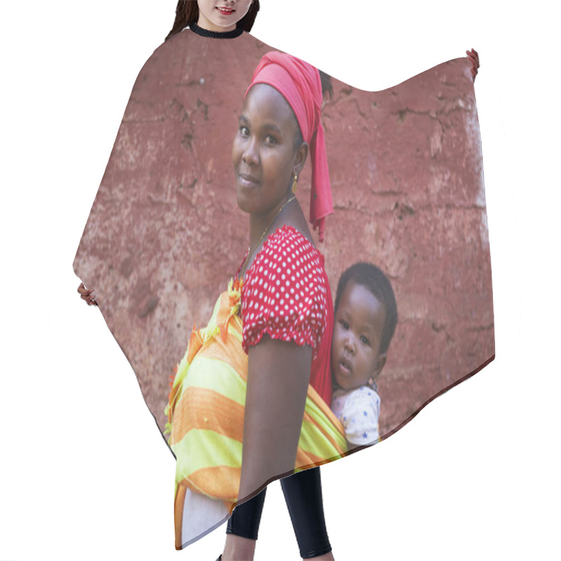 Personality  Bissau, Republic Of Guinea-Bissau - January 31, 2018: Portrait Of A Mother And Her Baby Daughter At The Cupelon De Cima Neighborhood In The City Of Bissau, Guinea Bissau. Hair Cutting Cape