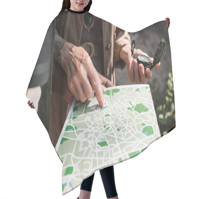 Personality  Cropped View Of Senior Woman With Compass Pointing At Map Near African American Husband  Hair Cutting Cape