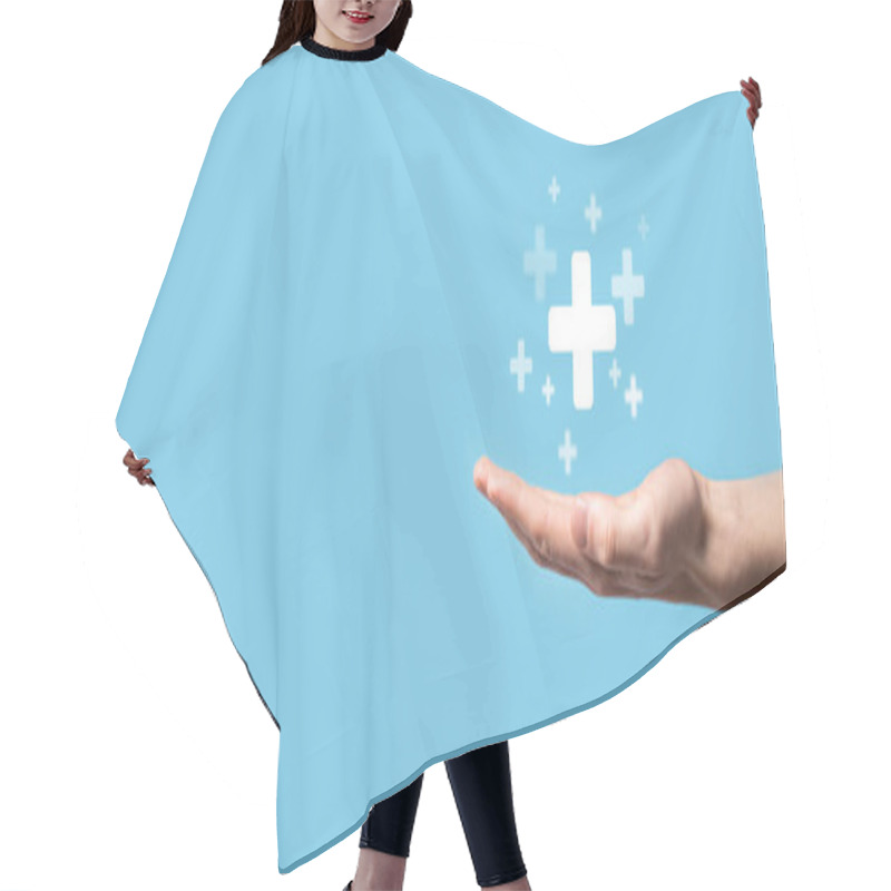 Personality  Male Hand Holding Plus Icon On Blue Background. Plus Sign Virtual Means To Offer Positive Thing Like Benefits, Personal Development, Social Network Profit,health Insurance, Growth Concepts. Hair Cutting Cape