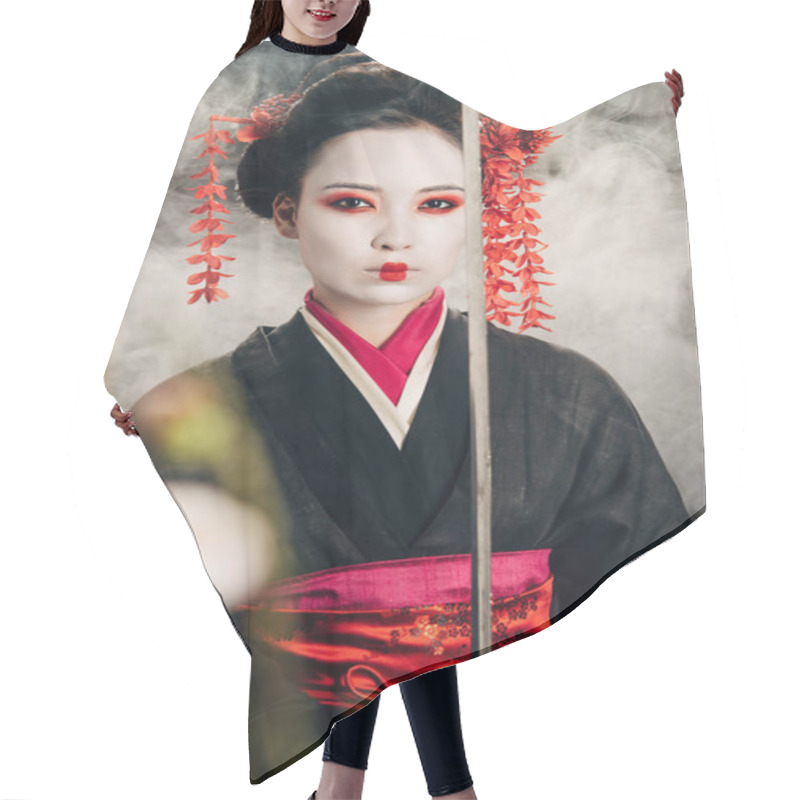 Personality  Selective Focus Of Beautiful Geisha In Black Kimono Holding Katana In Smoke And Sakura Branches Hair Cutting Cape