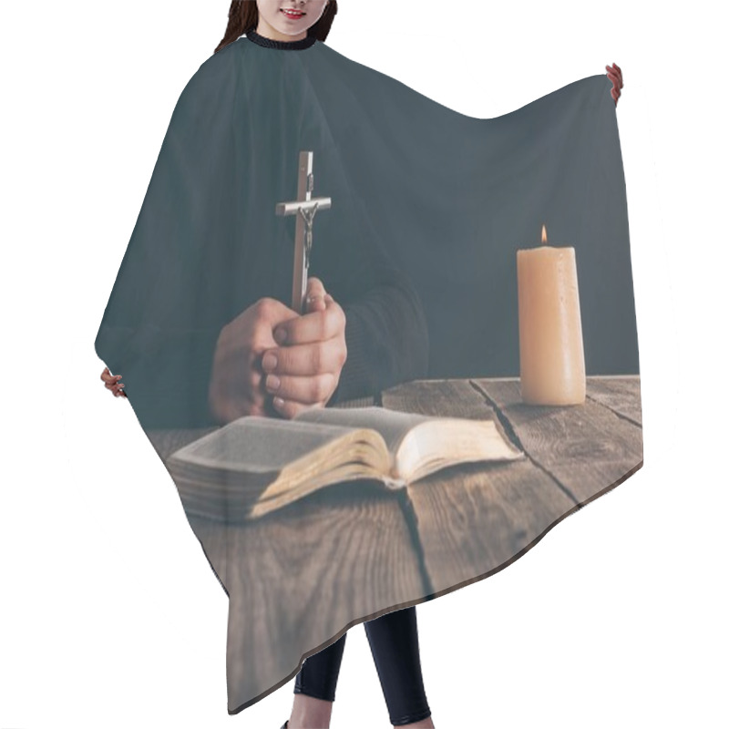 Personality  Cropped Image Of Christian Sitting With Cross In Hands Hair Cutting Cape