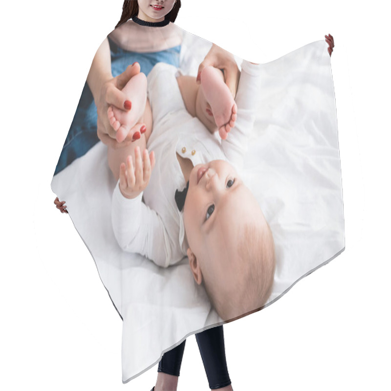 Personality  Mother Touching Bare Feet Of Cute Infant Son In Baby Romper  Hair Cutting Cape