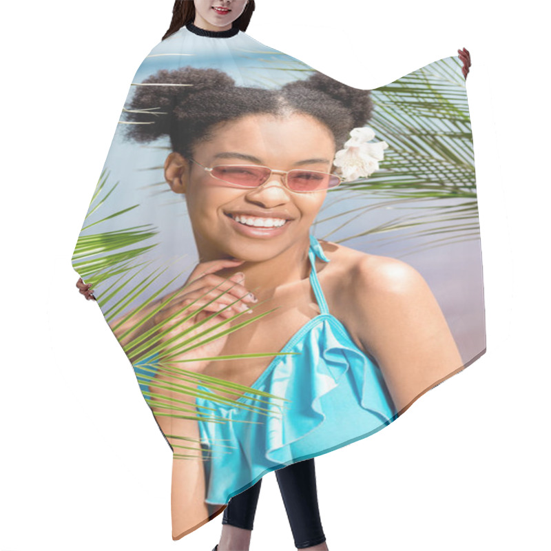 Personality  Happy African American Woman In Sunglasses With Flower In Hair Near Palm Leaves In Front Of Sea Hair Cutting Cape