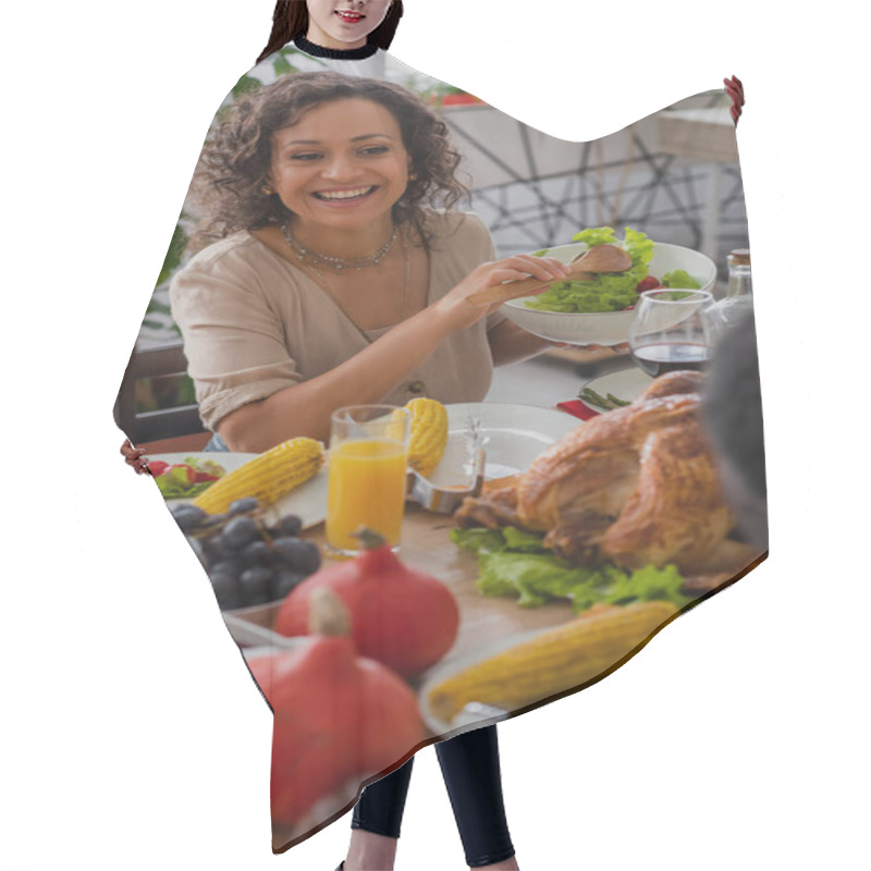 Personality  Happy African American Mother Holding Salad Near Blurred Father And Traditional Thanksgiving Dinner  Hair Cutting Cape