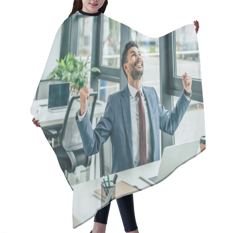 Personality  Happy Businessman Looking Up And Showing Winner Gesture While Sitting At Workplace Hair Cutting Cape