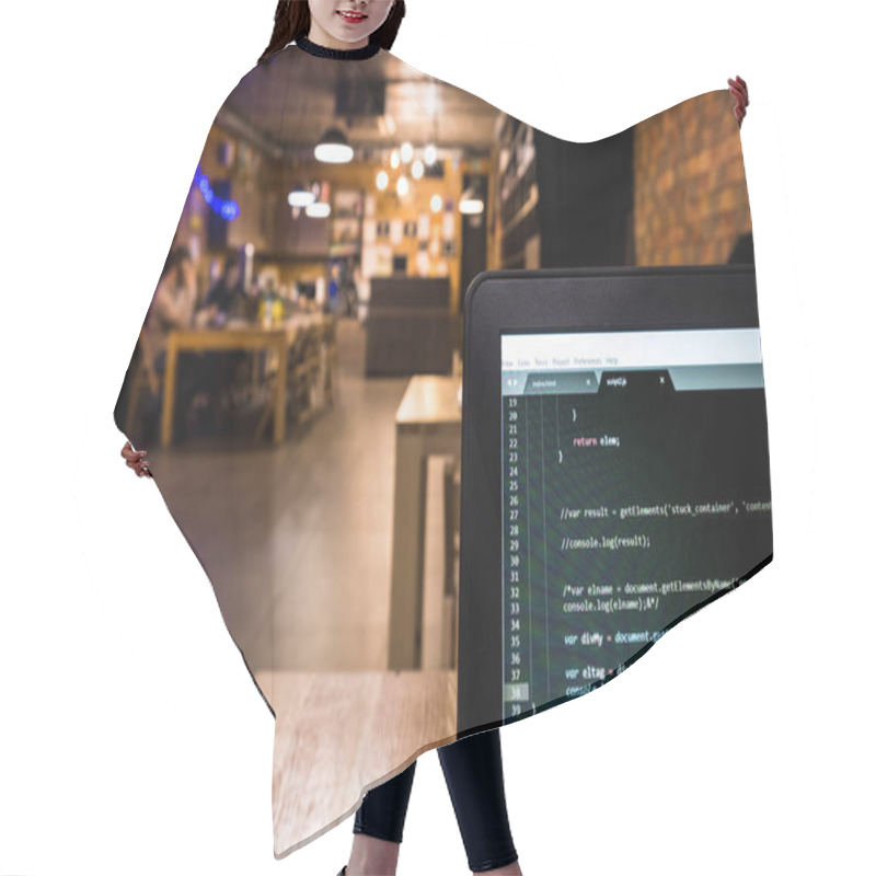 Personality  Laptop With Programming Code In Office Desk. Low Depth Of Field. Hair Cutting Cape