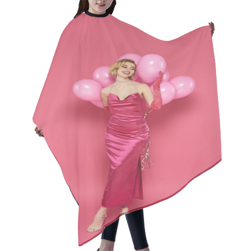 Personality  A Smiling Woman In A Pink Satin Dress Holds Pink Balloons Against A Pink Background. Hair Cutting Cape