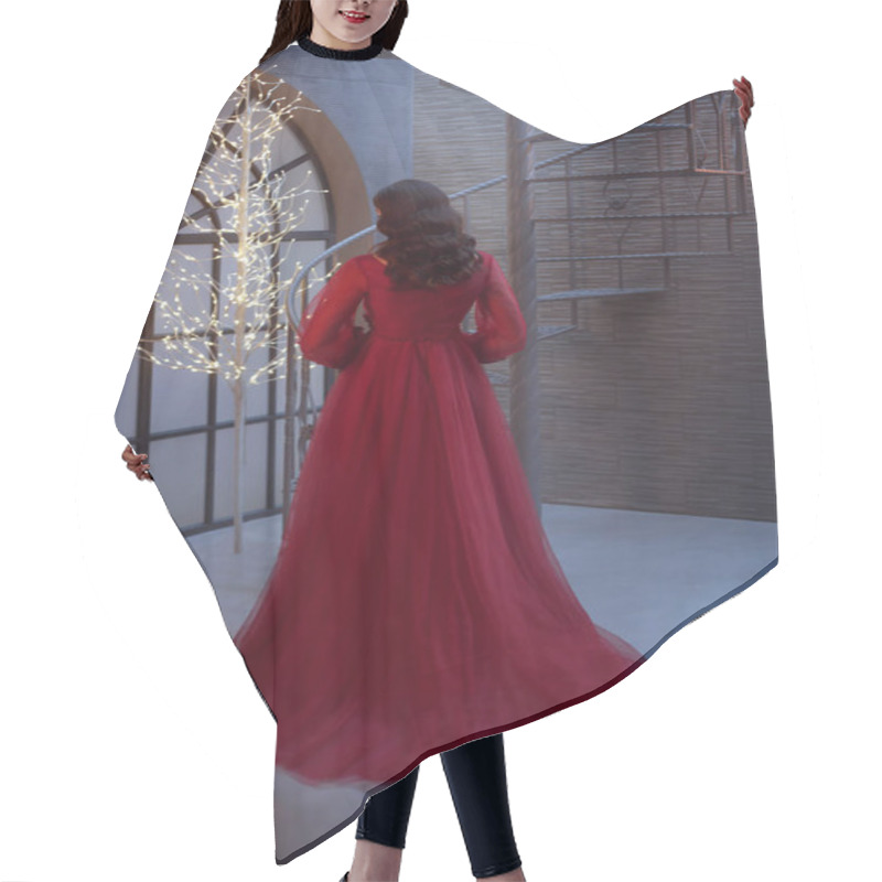 Personality  Girl In A Delightful Red Luxurious Long Dress With Her Back To The Camera, Demonstrates Dark Hair With Perfect Waves, A Loft-style Room, Bright Ones Alone In The Tree. Photo Without A Face. Hair Cutting Cape