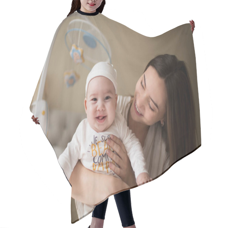 Personality  Happy Smiling Young Mother Playing With Her With Newborn Baby In The Bedroom. Parenthood Concept Hair Cutting Cape