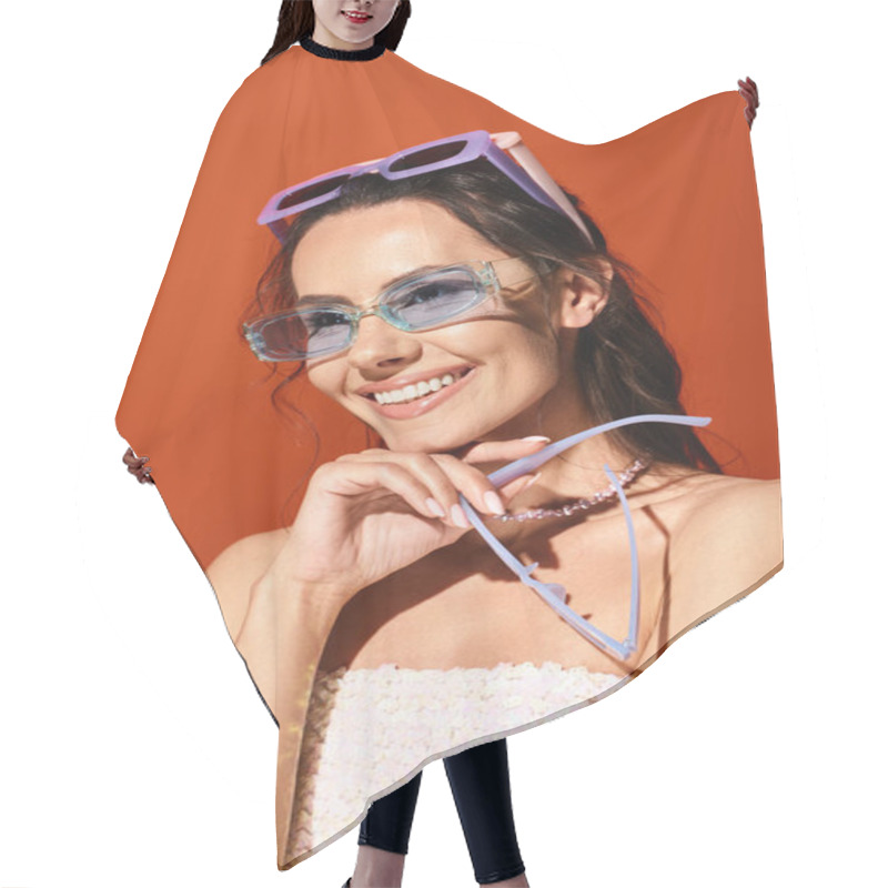 Personality  A Fashionable Woman Exudes Elegance In A White Dress And Sunglasses, Standing Confidently In A Studio With A Warm Orange Background. Hair Cutting Cape