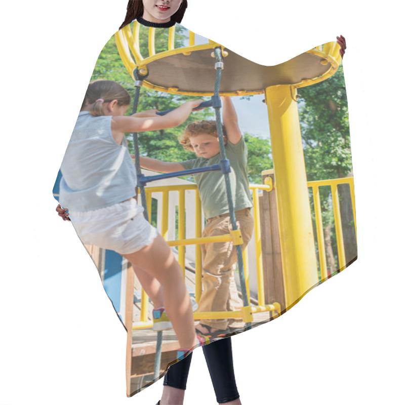 Personality  Brother And Sister Climbing On Rope Ladder While Having Fun In Amusement Park Hair Cutting Cape