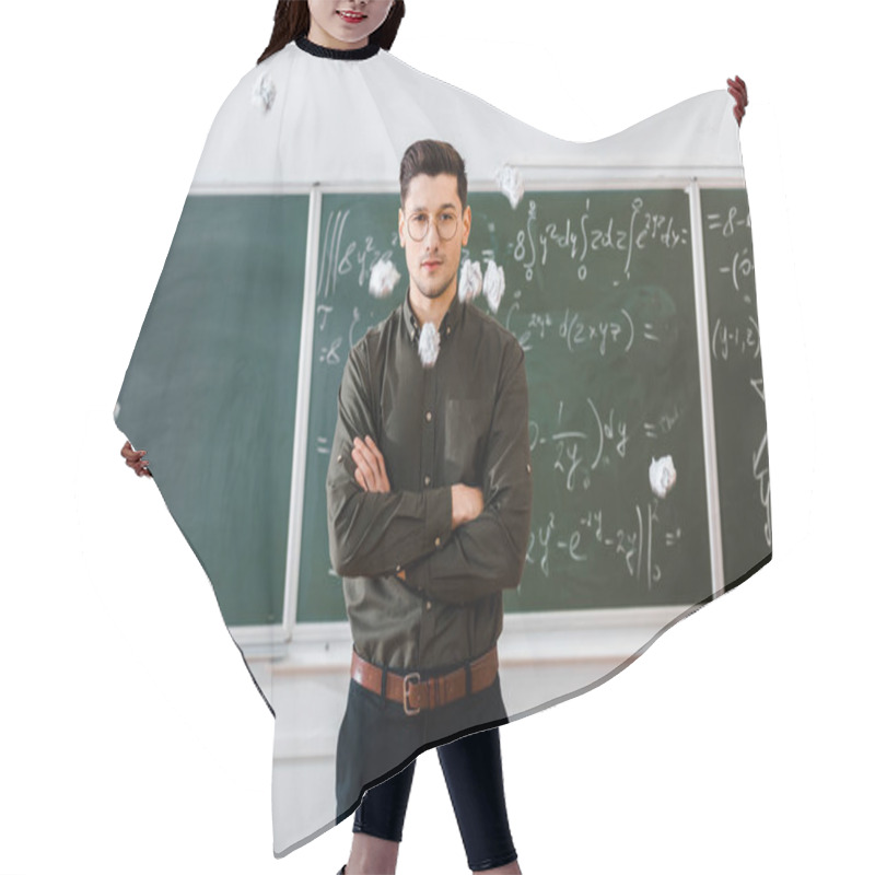 Personality  Crumpled Paper Balls Flying At Male Teacher With Arms Crossed In Classroom With Chalkboard On Background Hair Cutting Cape