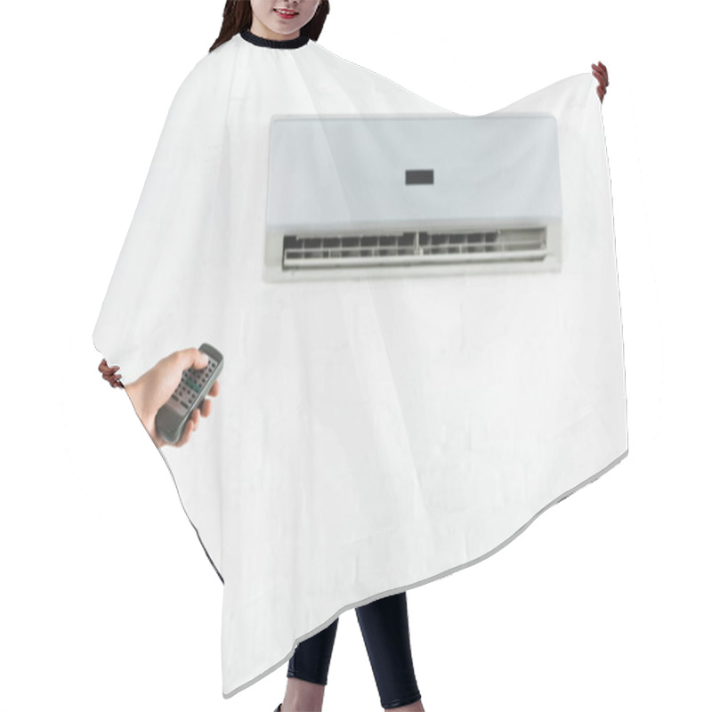 Personality  Cropped View Of Man Suffering From Heat And Switching Temperature Of Air Conditioner At Home Hair Cutting Cape