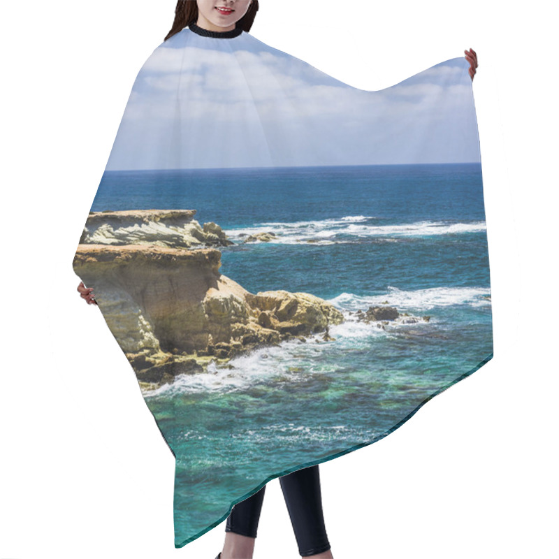 Personality  Rocky Cape Issued Far Into The Sea, Where It Is Washed By The Foamy Waves Of The Sea. Hair Cutting Cape