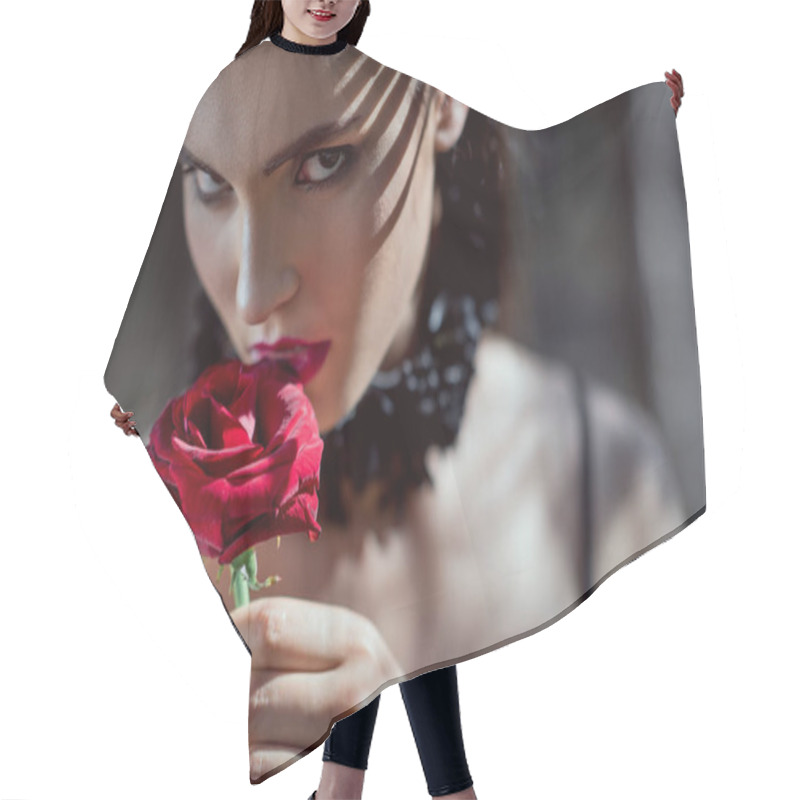 Personality  Portrait Of Beautiful Woman In Black Costume Holding Red Rose In Hand, Looking At Camera Hair Cutting Cape