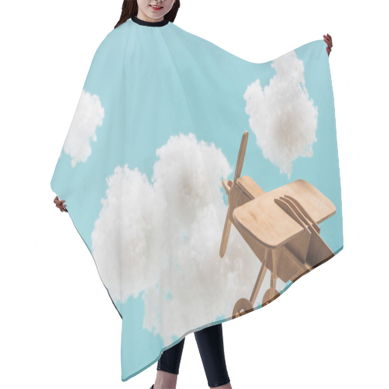 Personality  Wooden Toy Plane Flying Among White Fluffy Clouds Made Of Cotton Wool Isolated On Blue Hair Cutting Cape