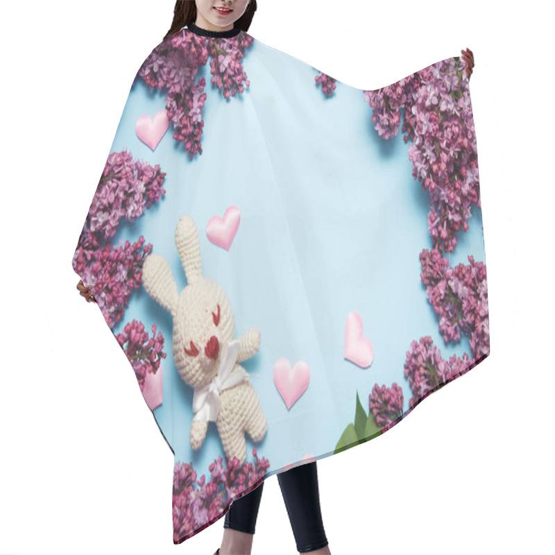 Personality  Lilac Flowers With Knitting Toy Rabbit On Blue Background. Top View, Flat Lay, Copy Space. Hair Cutting Cape