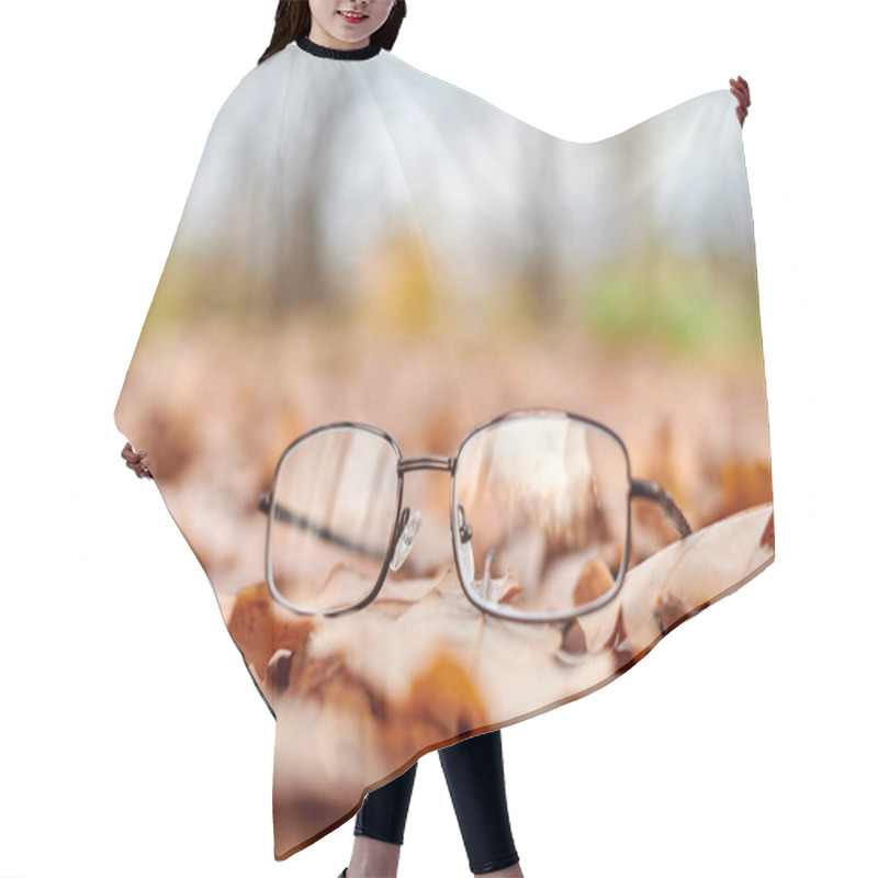 Personality  Glasses On Autumn Foliage. Lost Glasses As Symbol Of Sudden Vision Loss. Vitamin Deficiency With Age. Hair Cutting Cape