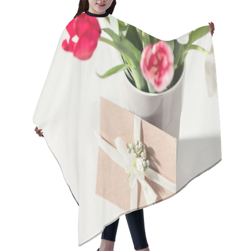 Personality  Selective Focus Of Beautiful Blooming Tulip Flowers In Vase And Envelope On Grey Hair Cutting Cape