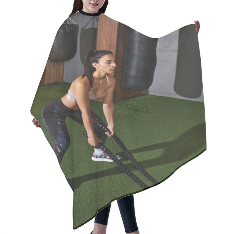 Personality  Fit Young Woman Intensively Trains With Battle Ropes For Strength. Hair Cutting Cape