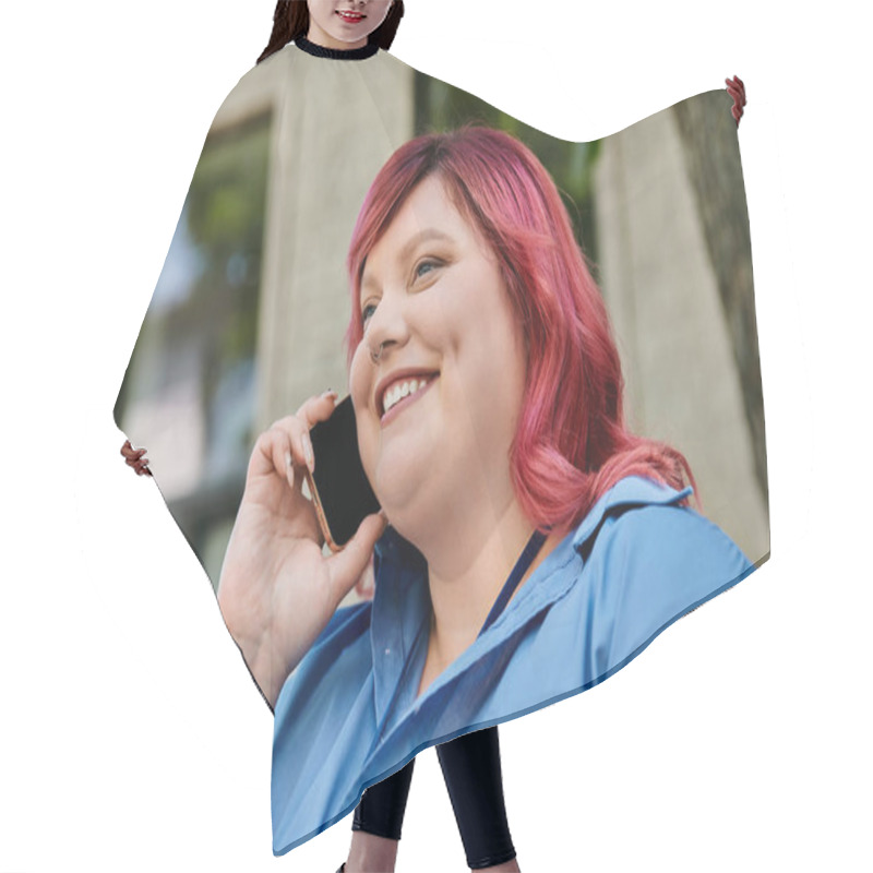 Personality  A Plus Size Woman In A Blue Shirt Talks On Her Phone While Smiling Brightly. Hair Cutting Cape