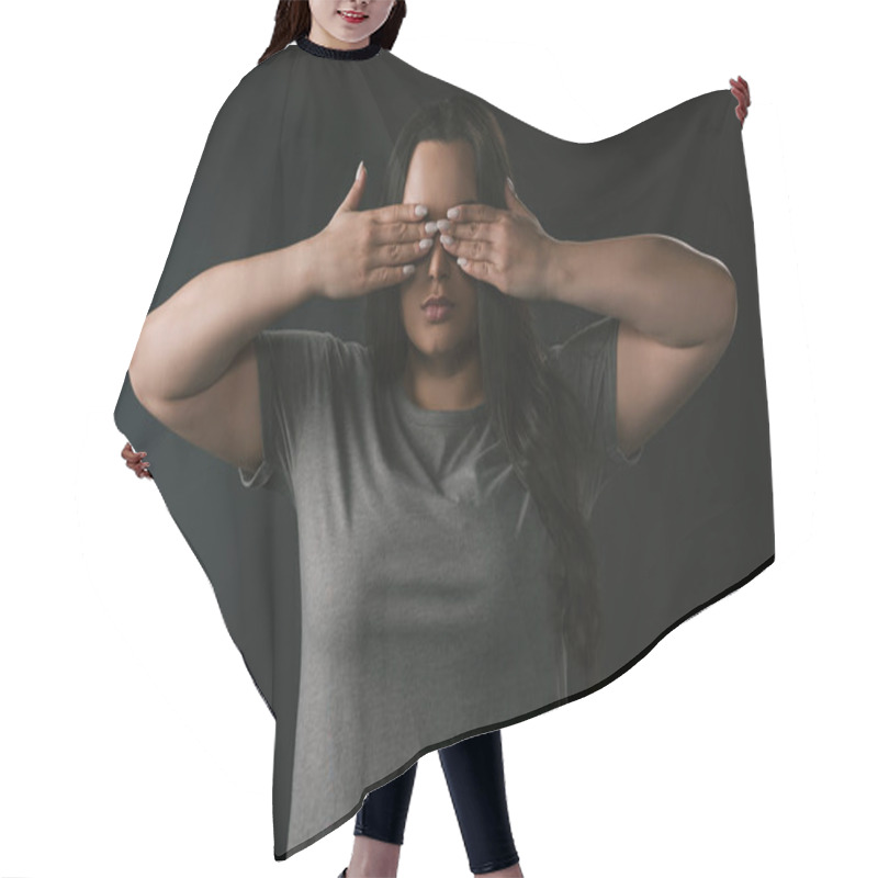 Personality  Front View Of Plus Size Girl Performing Blindness By Covering Eyes With Hands On Black Background  Hair Cutting Cape