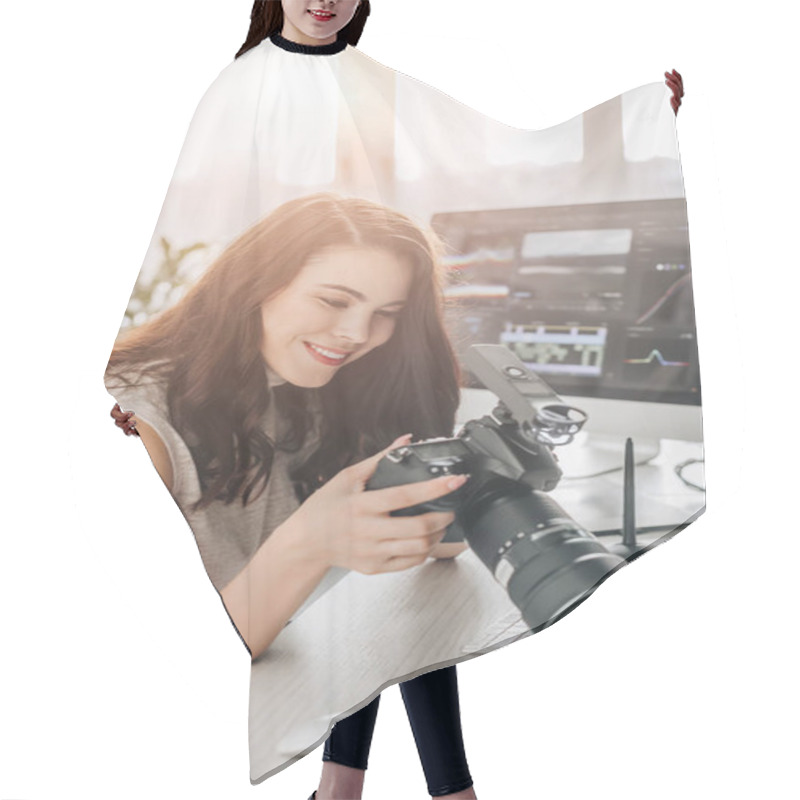 Personality  Happy Art Editor Holding Digital Camera Near Computer Monitor  Hair Cutting Cape