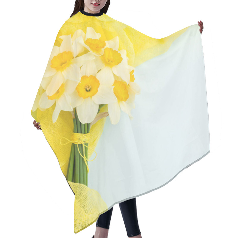 Personality  Daffodil Bouquet With Yellow Textile Decoration On Blue Pastel Background With Copy Space. Hair Cutting Cape