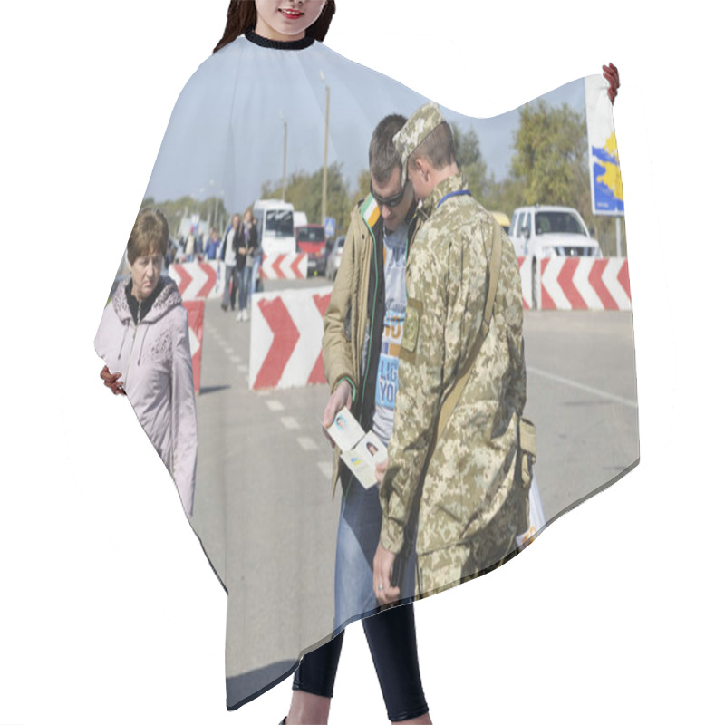 Personality  Border Guard Checking Passport Of Traveller At The Border Crossing Point Kalanchak, Ukrainian-Russian Land Border. September 20, 2017. Kalanchak Region, Khersonskaya Oblast, Ukraine Hair Cutting Cape