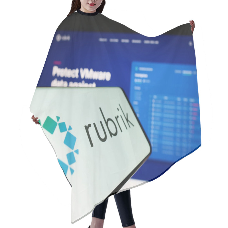 Personality  Stuttgart, Germany - 03-30-2023: Mobile Phone With Logo Of American Data Security Company Rubrik Inc. On Screen In Front Of Website. Focus On Center-left Of Phone Display. Hair Cutting Cape