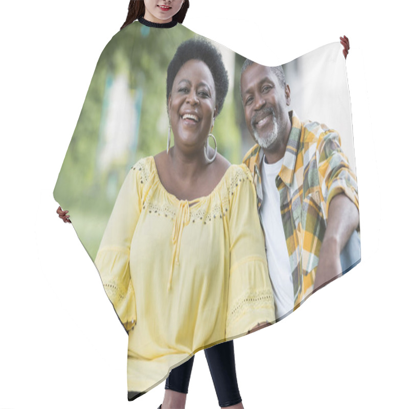 Personality  Smiling And Senior African American Couple Looking At Camera  Hair Cutting Cape