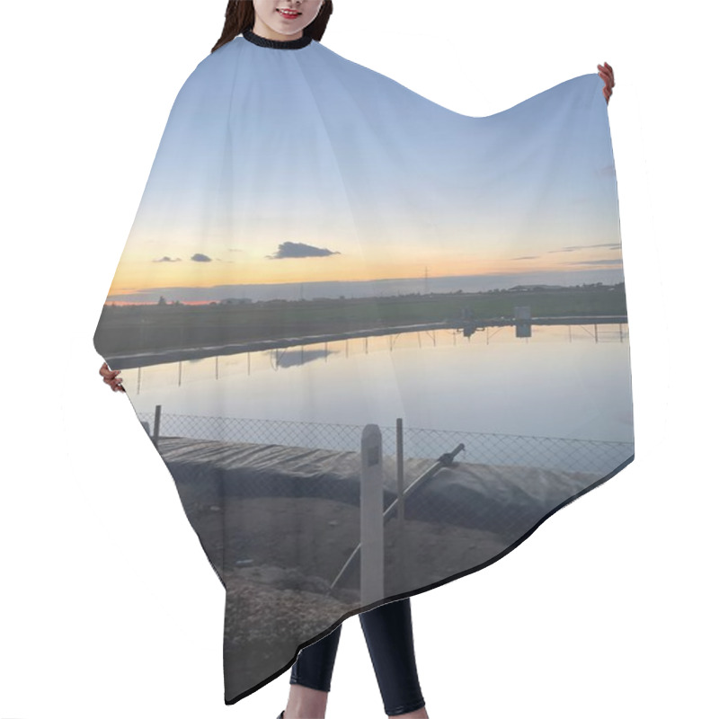 Personality  A Tranquil Pond Reflects The Hues Of Dusk, Creating A Serene Atmosphere. The Industrial Silhouettes And Clear Evening Sky Add Contrast To This Peaceful Scene. Hair Cutting Cape