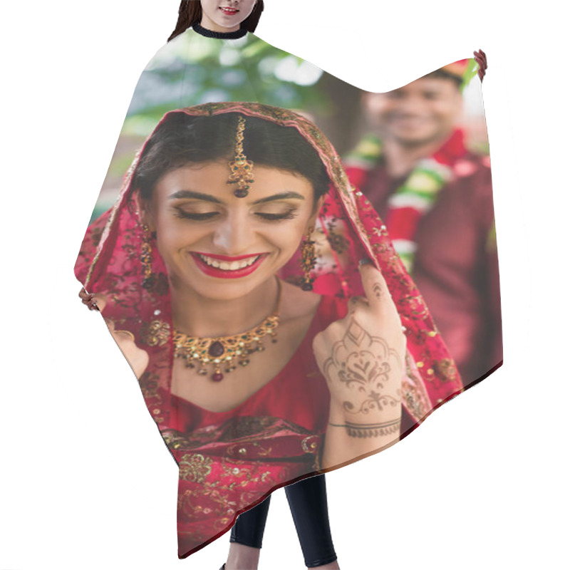 Personality  Cheerful Indian Bride In Sari And Headscarf Near Blurred Man In Turban On Background  Hair Cutting Cape