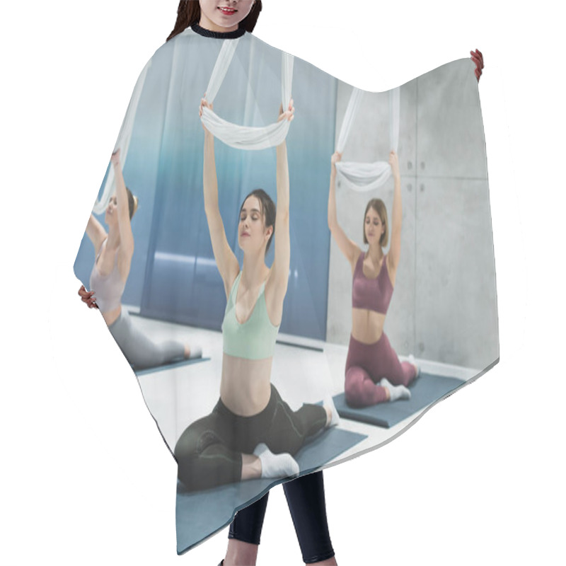 Personality  Sportive Women With Closed Eyes Stretching With Aerial Yoga Straps While Sitting On Fitness Mats Hair Cutting Cape