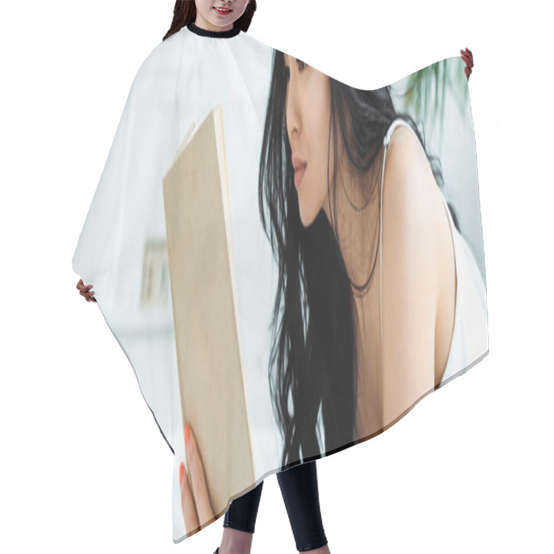 Personality  Panoramic Shot Of Brunette Thai Woman Reading Book At Home  Hair Cutting Cape