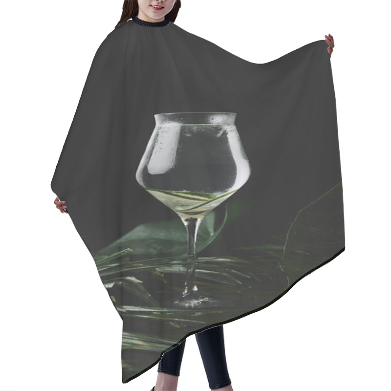 Personality  Close-up View Of Glass With Refreshing Beverage And Fresh Green Tropical Leaves On Black  Hair Cutting Cape