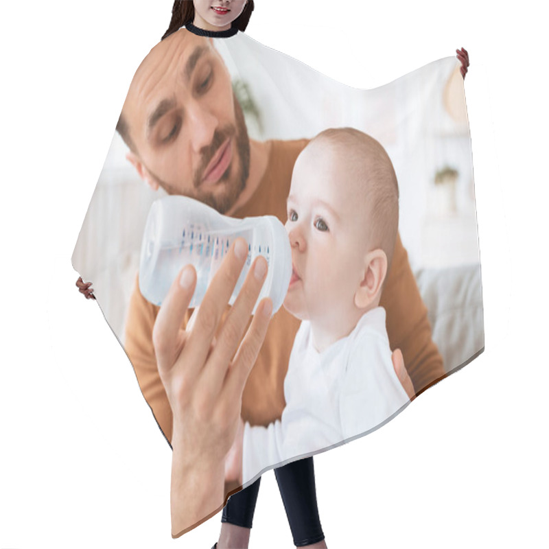 Personality  Dad Giving Bottle To Baby Sitting On Couch At Home Hair Cutting Cape