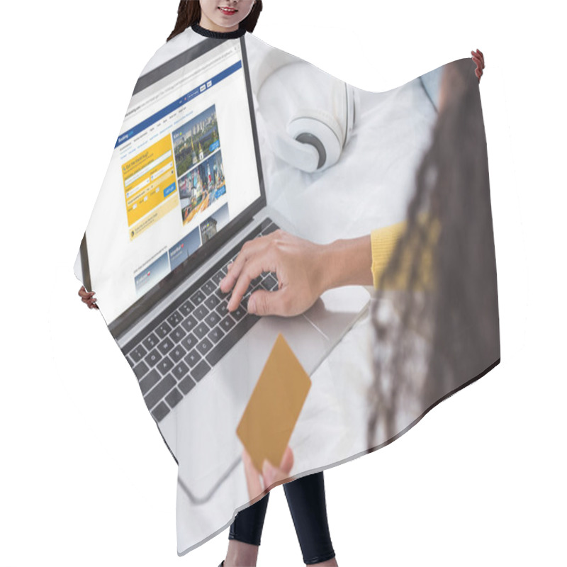 Personality  Cropped Image Of Woman Holding Credit Card And Using Laptop With Booking On Screen Hair Cutting Cape