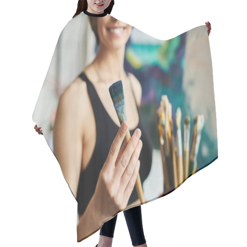 Personality  A Woman Holds A Paintbrush, Ready To Create Art. Hair Cutting Cape