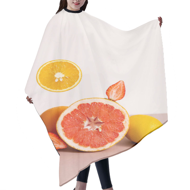 Personality  Fruit Composition With Citrus Fruits And Strawberry Isolated On Beige Hair Cutting Cape