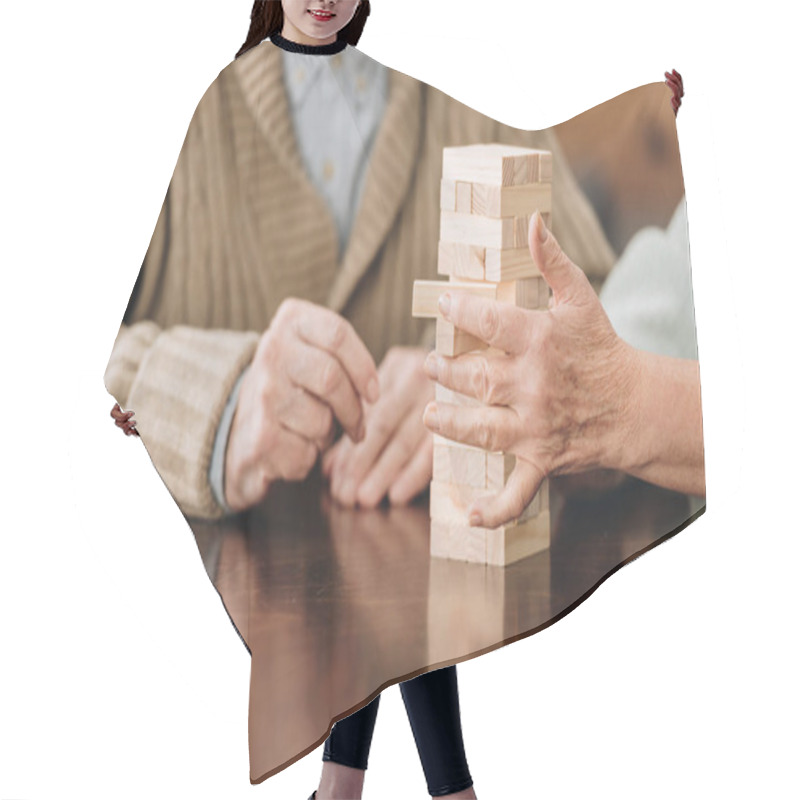 Personality  Cropped View Of Senior Couple Playing Jenga At Home Hair Cutting Cape